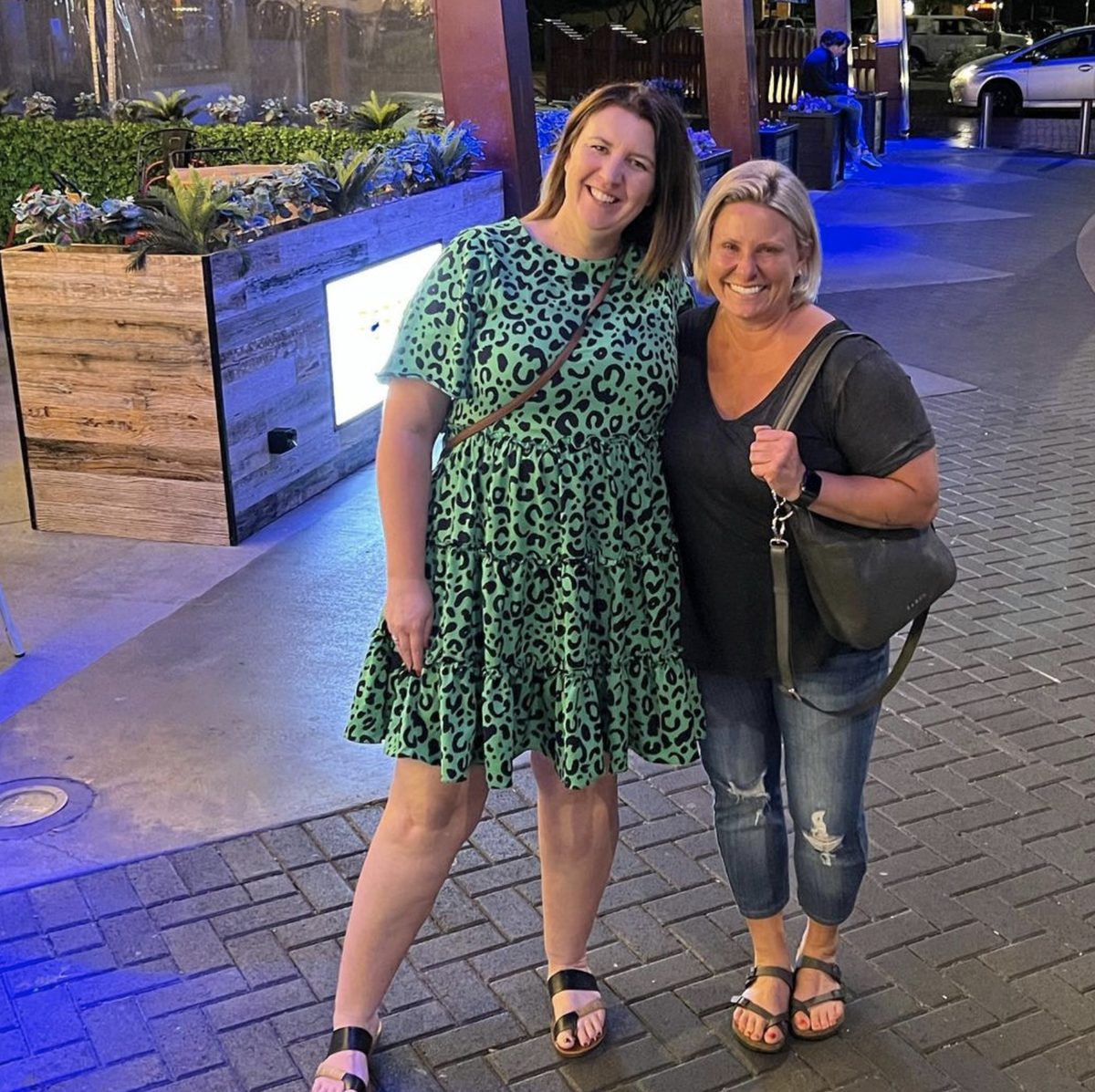Success story student Amanda Hoffman posing for a photo with NZIE tutor Jen Kirchoffer