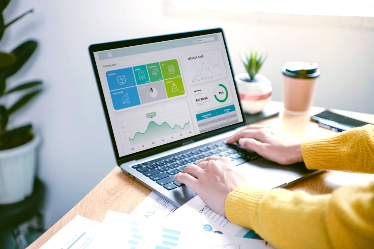sales data on laptop key top metric